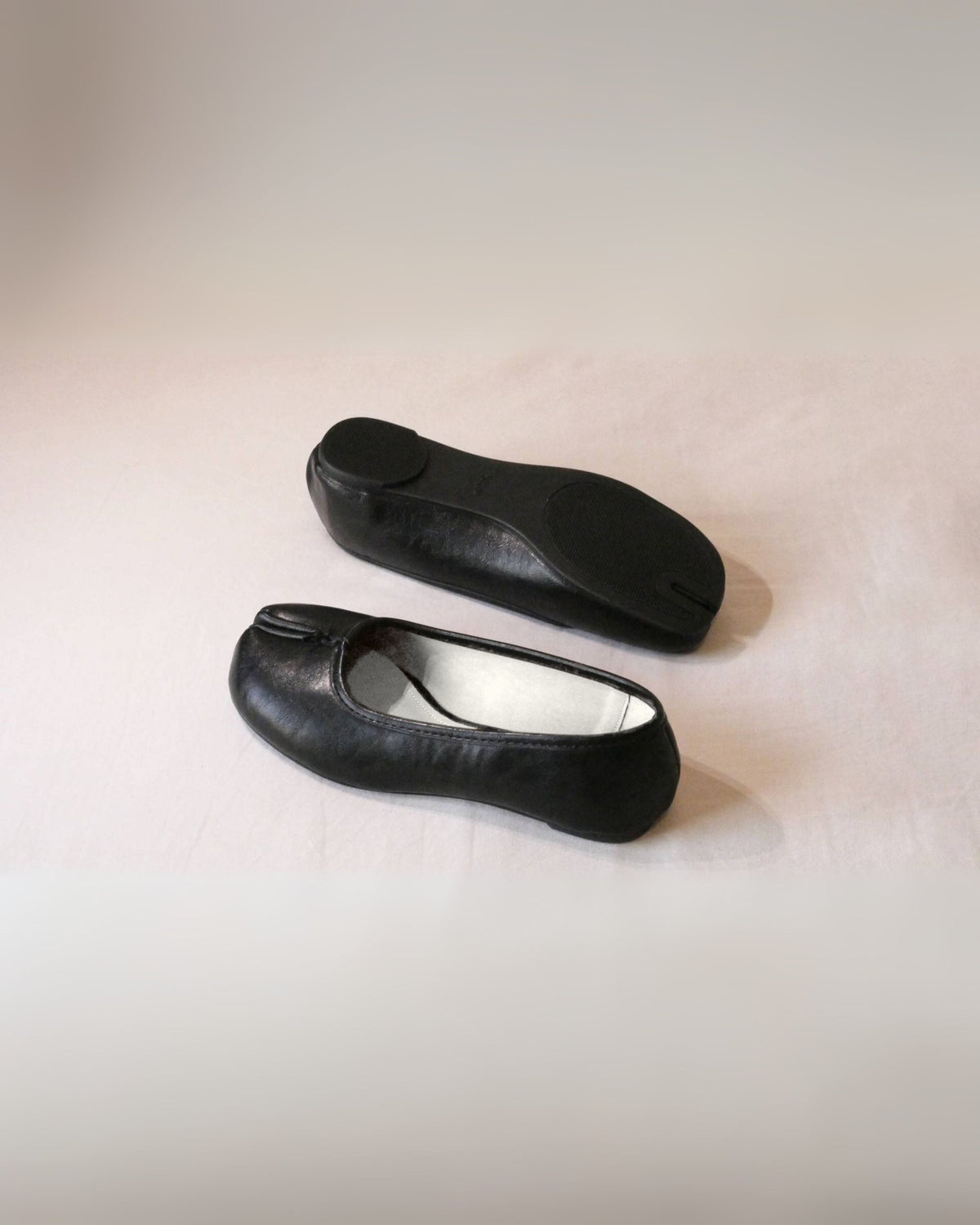 Tabi Flats, black vegan leather split toe ballet flats with a white insole, by Maison Nakamoto