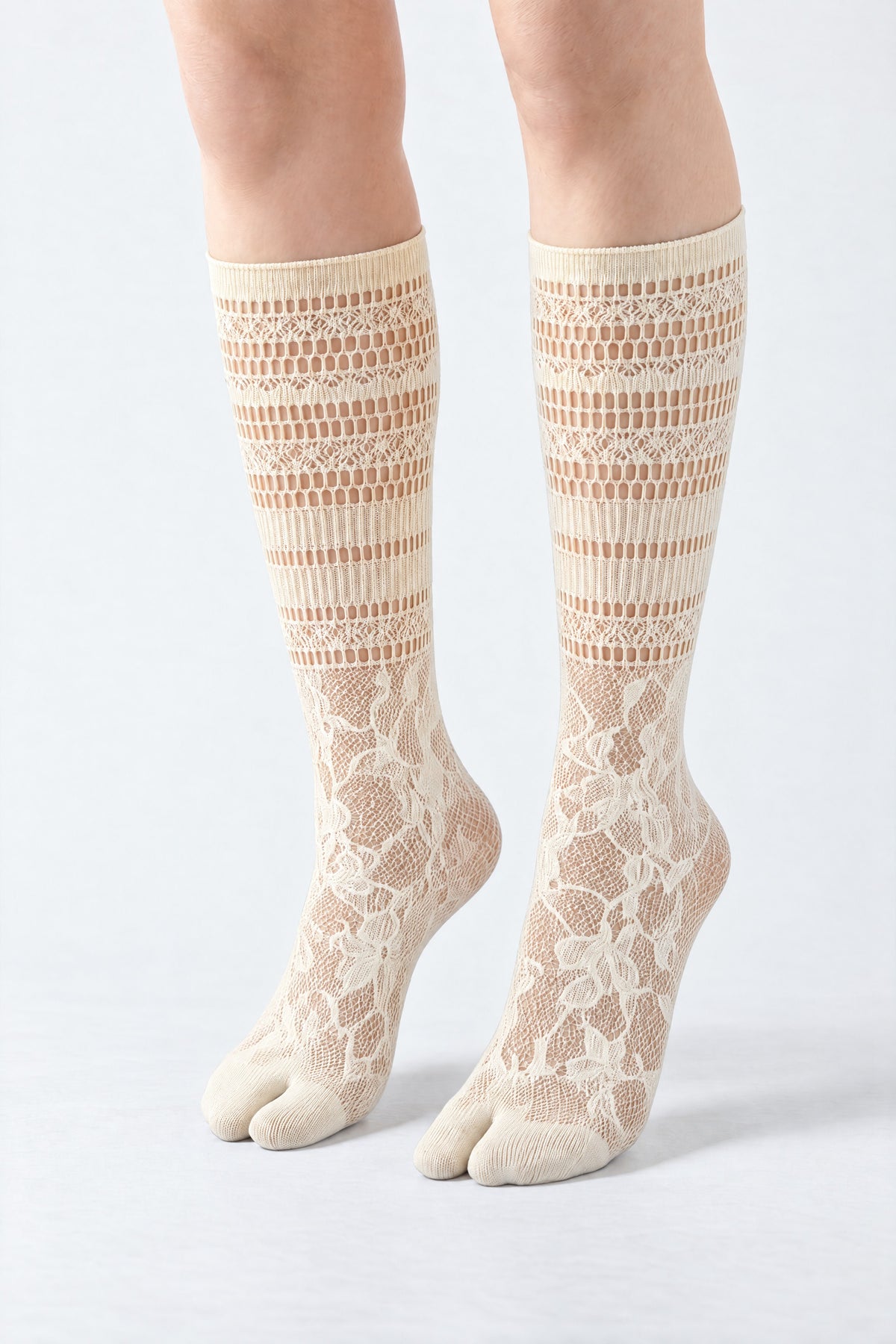 Tabi Lace Socks in beige, worn on tiptoe