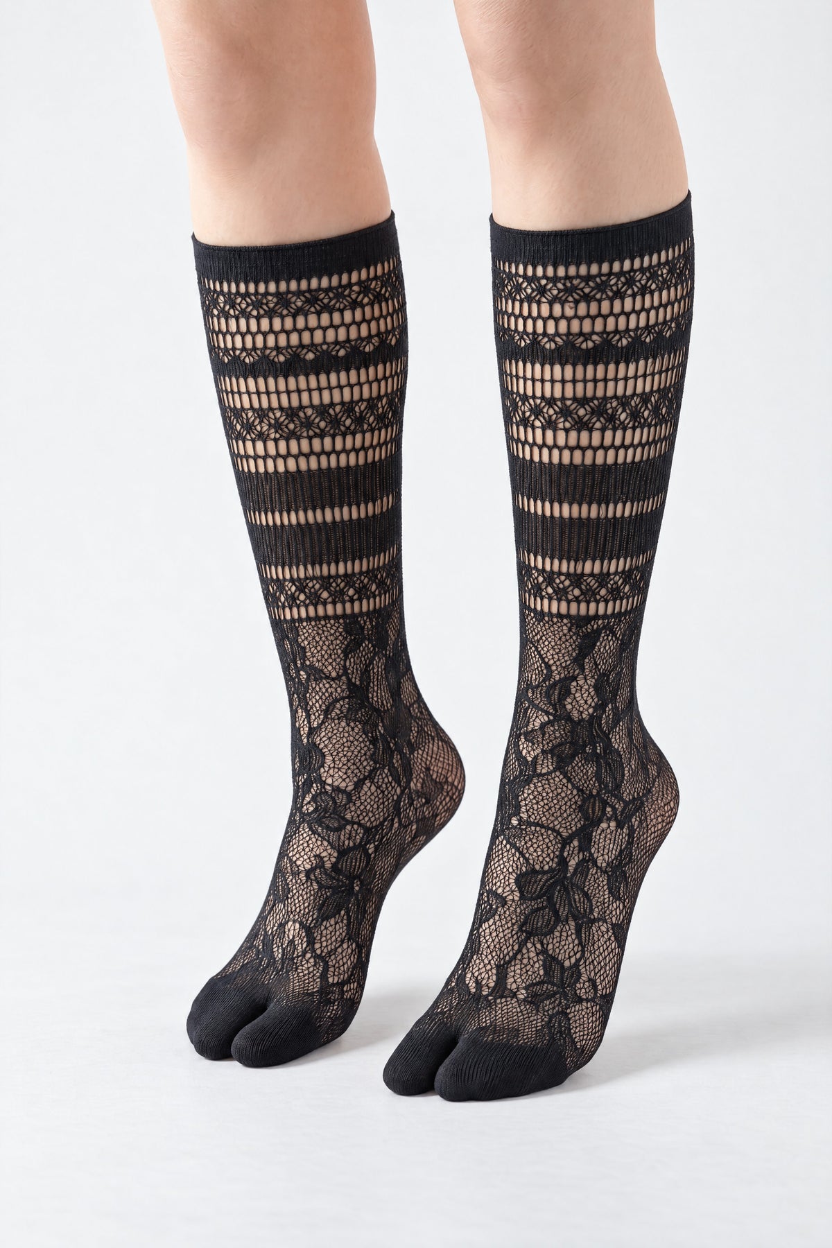 Tabi Lace Socks in black, worn on tiptoe