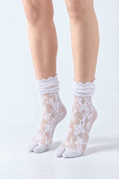 Tabi Lace Socks in white, worn scrunched down