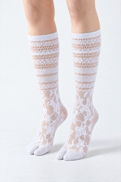 Tabi Lace Socks in white, worn on tiptoe